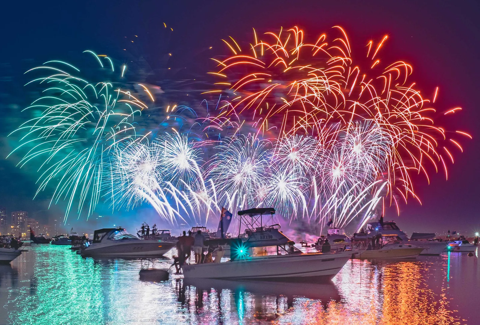 Fireworks over water taxis on Sydney Harbour during Australia Day celebrations