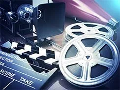 Film reel and clapperboard representing filming on the water