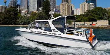 Majestic water taxi charter cruising with the Sydney city skyline behind